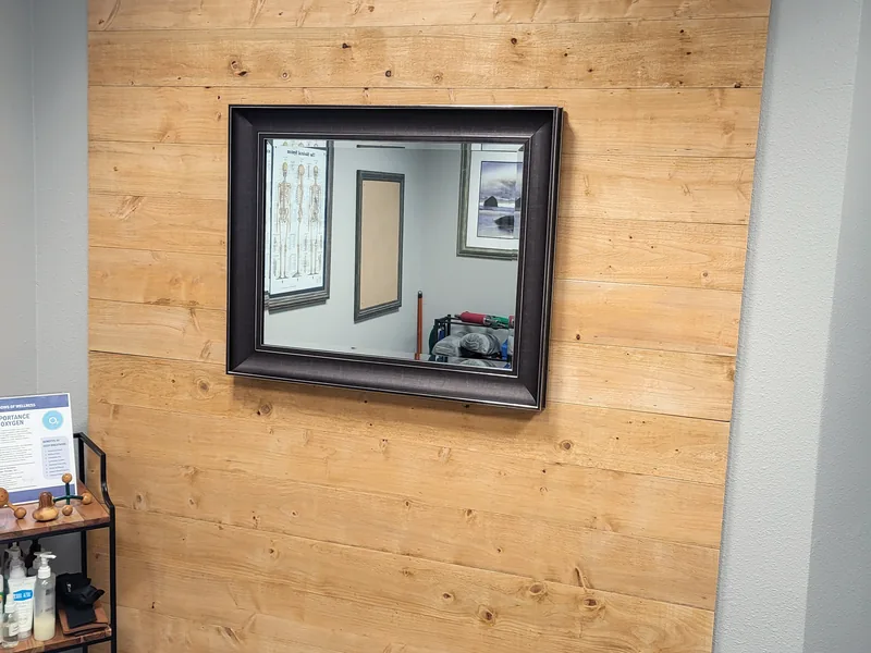 Framed mirror on the cedar plank wall of the Windows of Wellness treatment room, Lake Mary, FL